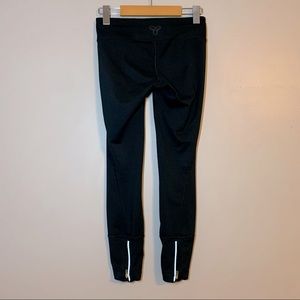 XXS TNA Aritzia black leggings with zippers at back of leg